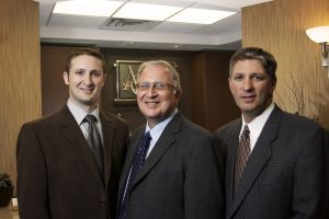 Oral surgeon consulting with a patient
